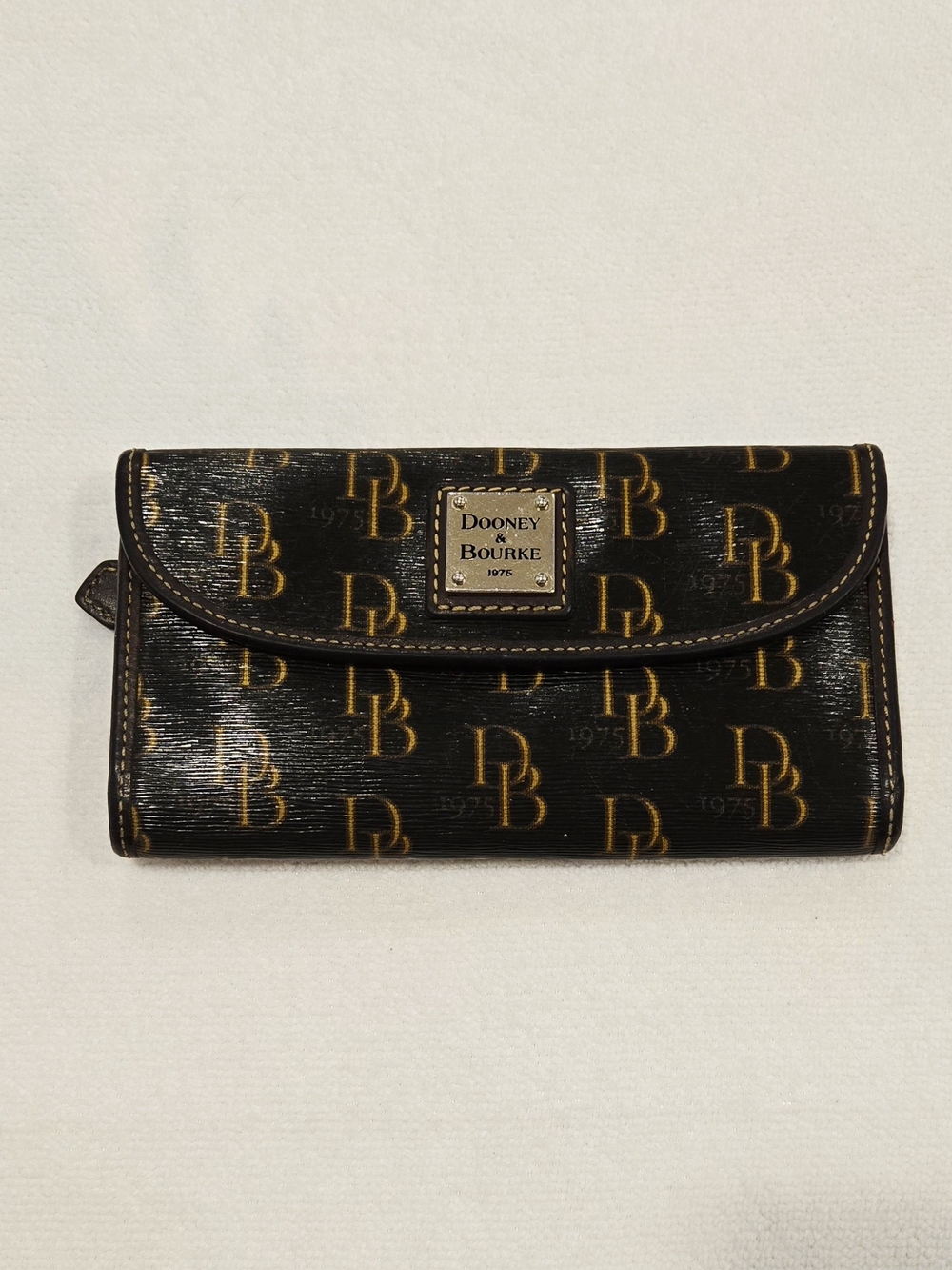 Dooney & Bourke Black and Gold Monogram Logo Flap Wallet
